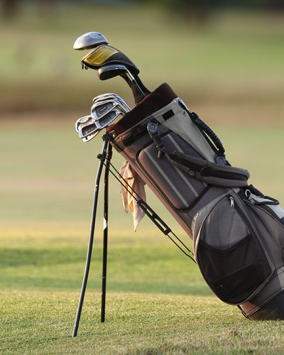 closeup-of-a-golf-bag-with-clubs-in-a-golf-course-2025-02-02-14-58-32-utc